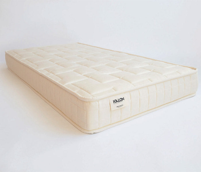 Photo of natural colored Kalon crib mattress.